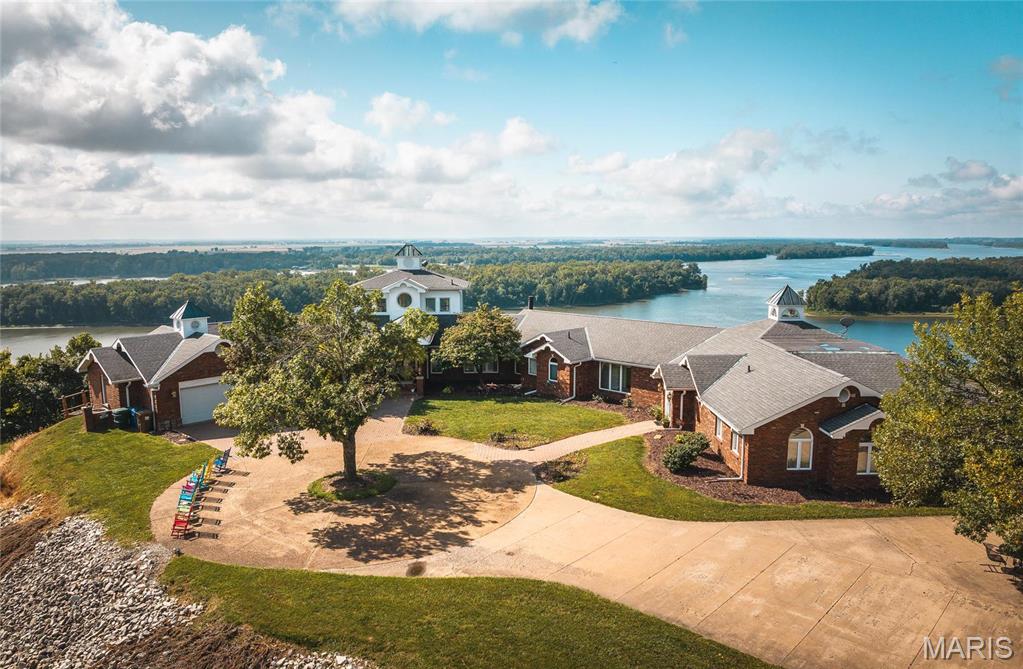 Welcome to this fabulous bed &breakfast opportunity overlooking the confluence of the Mississippi and Illinois Rivers. Nestled amongst the lush greenery and limestone bluffs that tower above the quaint river town of Grafton, IL. Its stunning views and tranquil atmosphere offer plenty of potential for growth and development. Tara Point has long been the destination of its repeat customers since 1991. In addition, the business is well known for providing its guests with extraordinary service and unparalleled attention to detail, thus insuring their loyal customers a relaxing and memorable stay. Guests can enjoy the amenities of the Inn while staying in one of the Riverside rooms or Delta Queen suite. Additionally, Tara Point offers eight guest cottage suites. Tara Point has been recognized by an industry publication for having the “Best Sunset View” of over 8,500 B & B’s in North America. All guests are in awe of the views their accommodation provides. Also under 23055336 as commercial.