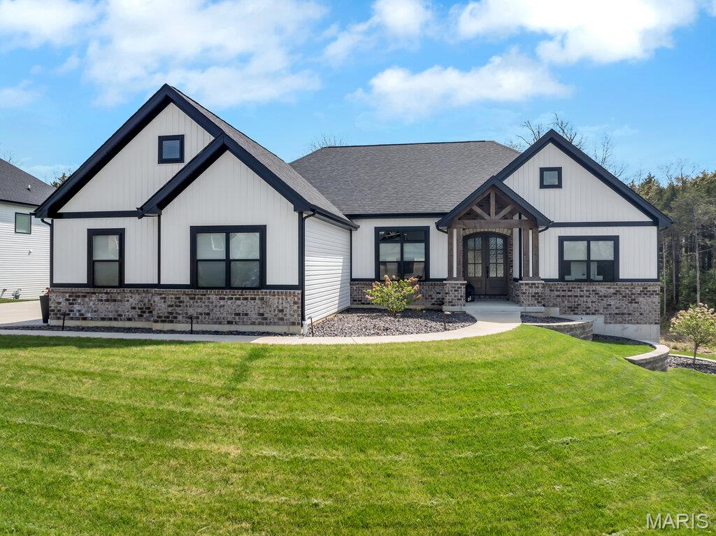 Why wait 8–12 months to build? This nearly new custom ranch offers all the upgrades buyers want today—without the delays.
Located in the desirable Hawthorne subdivision, this move-in ready home features over 3,200 square feet of finished living space, a walkout lower level, screened porch, designer kitchen, and a private backyard setting. Welcome to this stunning 3.5-year-old modern ranch offering the perfect blend of timeless design and today’s energy-efficient living. With 3 bedrooms, 2.5 baths, an additional office space, and striking curb appeal, this home makes a lasting impression from the moment you arrive.
Step inside to a thoughtfully designed open-concept floor plan featuring beautiful floors, abundant natural light, and high-end finishes throughout. The show-stopping kitchen is truly the heart of the home, showcasing quartz countertops, 42” cabinetry with crown molding, an extended center island, stainless steel appliances, built-in microwave, gas cooktop with designer vent hood, stylish tile backsplash, and modern black hardware.
The inviting great room features a cozy gas fireplace, custom built-in bookcases, and seamless access to the screened-in porch perfect for relaxing or entertaining. 
The spacious primary suite offers a tray ceiling, recessed lighting, sliding barn door, and a huge walk-in closet. The luxurious primary bath enhances the spa-like feel with beautifully designed finishes and ample space.
The partially finished walk-out lower level features a 10’ pour, providing impressive ceiling height along with additional living space and room to expand. Just off the 3-car garage, a convenient cubby/drop zone keeps life organized, while the spacious 3-car garage and irrigation system add both functionality and value. Why wait to build when you can move right into this like-new home? Schedule your appointment today
