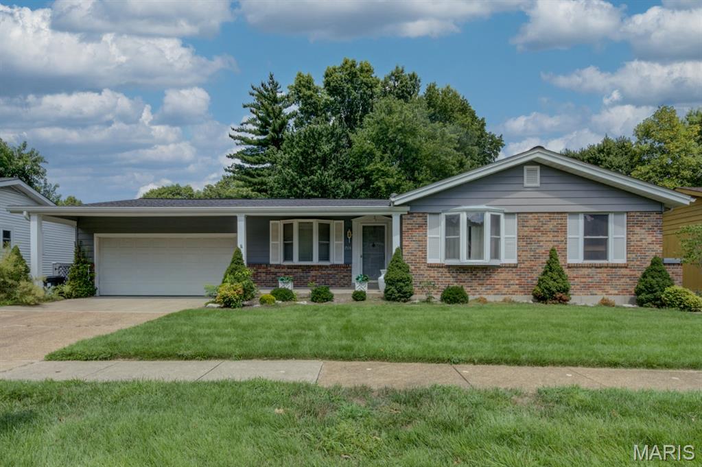 Absolutely incredible opportunity to own this huge 4-bedroom ranch home with 3 full bathrooms, 2-car garage w/insulated overhead door & keypad and a great level rear lot framed by mature picturesque trees - all on a quiet street. Large wood deck and handy shed add to the outdoor appeal. Low-maintenance exterior features vinyl siding, enclosed soffits/fascia and thermal windows while the brick trim, handsome front door millwork, cozy covered porch and established landscaping provide wonderful curb appeal. Spacious formal living and dining rooms feature bow windows while other indoor features include an open floor plan, striking wood floors, updated lighting, six-panel doors and 2" blinds. Vaulted family room offers fireplace, wet bar and open wood staircase to the lower level. Spacious kitchen and breakfast room boast abundant wood cabinetry, built-in shallow hutch, stainless appliances including 2 refrigerators, gorgeous granite counters and stunning tile backsplash. French doors lead to a spectacular sunroom with impressive wood ceiling and skylights—an inviting oasis to relax and unwind. The primary suite includes 3 closets and a private bath. The finished lower level adds tremendous versatility with a 2nd kitchen, 3rd refrigerator, huge recreation room w/bar & electric fireplace, den, abundant storage and even more living space...  bringing the total to 4,104 finished square feet! This fantastic property is being sold AS IS, with no repairs or inspections performed by the seller. Heavily improved but ready for some TLC, it offers rare and wonderful sweat-equity potential with so many updates already completed. No City Occupancy Inspection will be provided.