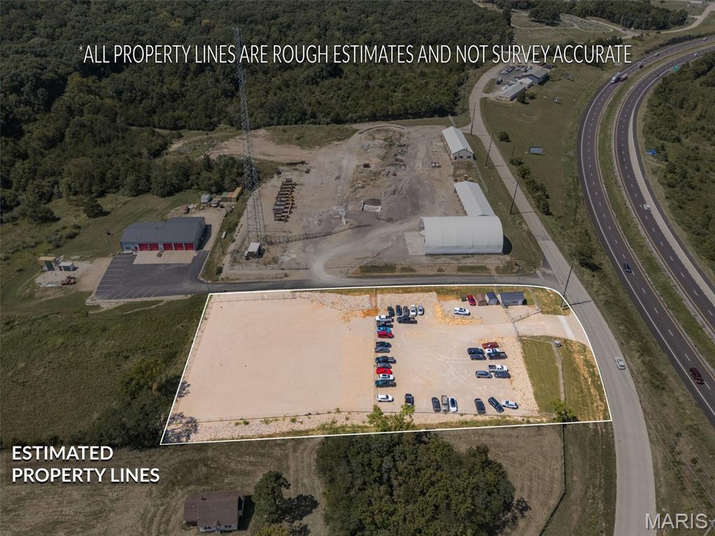 INCOME-PRODUCING COMMERCIAL OPPORTUNITY! 7319 Raider Rd offers 1.7 acres of fully cleared, rocked, and fenced property within the Bonne Terre city limits, with easy access to Highway 67 and Bonne Terre public water and sewer. The acreage is configured into two separately fenced sections, each with its own gated entrance and lighting, allowing the two areas to function independently. The front section is currently under a long-term lease generating $2,200 per month/$26,400 annually, providing established income from day one. The rear section is separately fenced with its own gated access and can be leased to another tenant for additional income or retained by the owner for business operations, equipment, vehicles, trailers, or storage. With extensive site improvements already completed, public utilities, convenient highway access, and two independently accessible areas, this property offers excellent flexibility for an investor or owner-user.