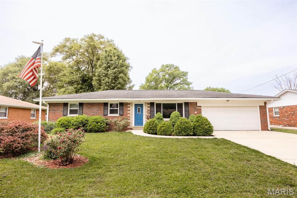 Welcome home to this beautifully maintained, move-in-ready 3-bedroom, 1-bathroom brick ranch that perfectly blends comfort, efficiency, and functionality. From the moment you arrive, the striking, architectural metal roof commands attention, offering not only premier curb appeal but the ultimate peace of mind with its incredible durability, weather resistance, and decades of low-maintenance longevity. Step inside to discover a spacious, light-filled layout featuring stunning wood floors throughout the main living areas, which flow effortlessly into a spectacular 15x13 screened in back porch—the ultimate spot for your morning coffee, a peaceful reading nook, or entertaining guests year-round. Out back, your private oasis awaits in a level yard fully enclosed with a wood privacy fence, making it perfect for pets, play, or relaxing in seclusion. Hobbyists, creators, and DIY enthusiasts will absolutely fall in love with the massive workshop shed, fully equipped and ready for your next project or extra storage. This home is packed with premium, energy-efficient upgrades, including a tankless water heater for endless hot water, a deep 26x19 attached 2-car garage, and a prime location nestled in the desirable Cedar Haven subdivision. Don't miss out on this Belleville gem—schedule your showing today!