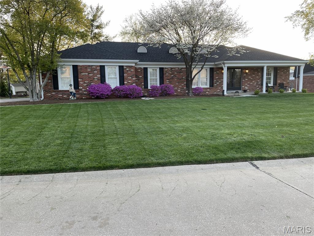 This home is a true showcase of refined living, blending timeless elegance with thoughtful modern updates in the heart of sought-after Creve Coeur. Meticulously maintained and beautifully renovated, this exceptional ranch offers 3 main floor bedrooms with additional sleeping area in the lower level, 3 full baths, and a powder room, all designed with comfort and style in mind.  At the heart of the home is a stunning chef-inspired kitchen featuring white soft-close cabinetry, gleaming quartz countertops, stainless steel appliances, and a picturesque window framing views of the beautiful backyard. Luxury vinyl plank flooring extends throughout the main living areas, while plush carpeting adds warmth and comfort to the secondary bedrooms. Every bath has been tastefully remodeled with quality finishes and contemporary design.  The thoughtfully designed floor plan offers effortless main-level living, highlighted by a sun-filled living room, elegant dining room, inviting family room with a gas fireplace, and a well-appointed laundry room with custom cabinetry. The spacious primary suite serves as a private retreat, complete with an updated bath and generous walk-in closet. The finished lower level is perfectly suited for entertaining and everyday enjoyment, featuring a stylish wet bar, expansive recreation room, second family room, full bath, and a versatile bonus sleeping area.  Outside, the home's attractive brick exterior, side-entry garage, and beautifully landscaped grounds create exceptional curb appeal. The level backyard offers an ideal setting for outdoor relaxation and gatherings on the spacious patio.  Ideally located just minutes from premier dining, shopping, hospitals, major highways, and award-winning Parkway Schools, this remarkable residence delivers the perfect combination of luxury, convenience, and location. A rare opportunity and true Creve Coeur gem.