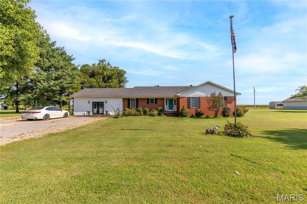 This amazing home is seeking its next owners, and it is a good one!!!  Spacious, excellent location, multiple living spaces, plenty of bathrooms, on over an acre of land, and a wonderfully functional layout!  As soon as you enter the neighborhood you will sense the country feel of being outside city limits but convenience of great neighbors and amenities not far away! Once you enter in the entryway you will find large living space with vaulted ceilings, beautiful beam work,and a fireplace! The kitchen has wonderful cabinet space, plenty of countertop space for cooking and an added bonus 2 kitchen sinks!  Dining area is cozy and right off kitchen as well as a very laundry room with a shower! On one end of the home you will find a huge family room with a storage room and a bathroom! On the other end of the home 3 bedrooms and 2 baths!  This one has a great layout and plenty of space for a family or someone who loves to have get togethers!!  Call today to schedule a tour!