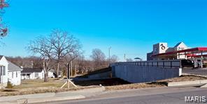 Great opportunity to have 120 feet of Highway  63 (Bishop Ave.) frontage! Just under half an acre with 2 rental houses. One is rented on a month to month for $460. per mo. Sits next door to Sonic, just a block from the Highway 63 & Highway 72 intersection.