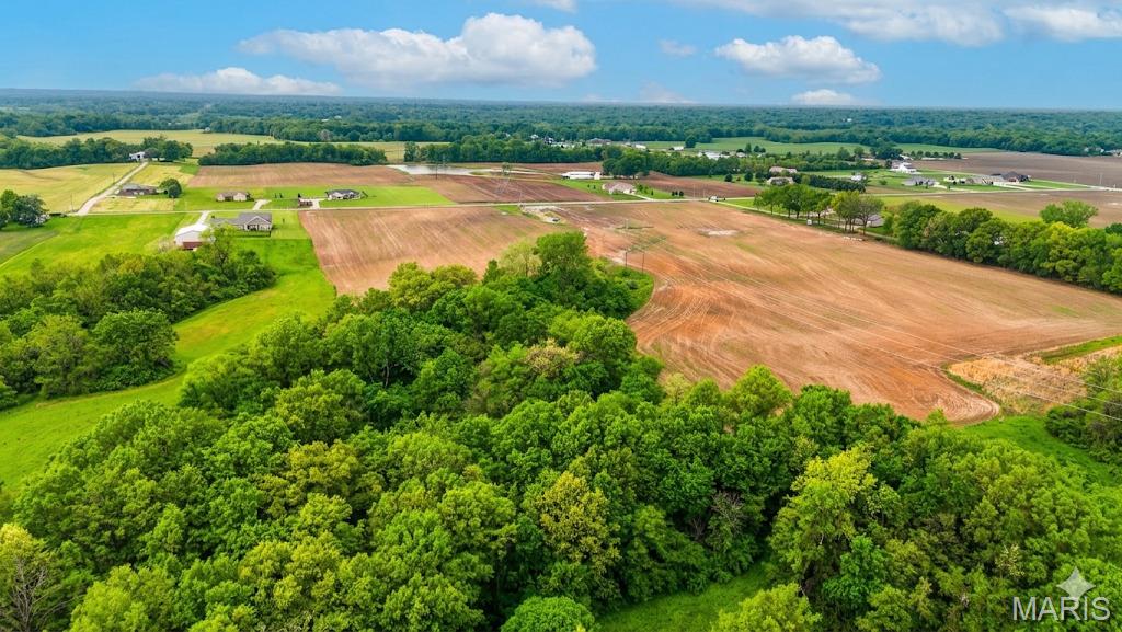 Discover the perfect balance of peaceful country living and everyday convenience with this beautiful 10-acre property in Bethalto. Tucked away in a serene setting, this rare parcel offers the ideal opportunity to build your dream home surrounded by nature, privacy, and wide-open space.

The property features a picturesque mix of open ground and mature woods, creating a stunning backdrop for a custom home, hobby farm, or private retreat. Whether you envision relaxing evenings under the stars, trails through the trees, or room to roam and grow, this land provides endless possibilities. Located in the highly sought-after Bethalto Community Unit School District 8, you’ll enjoy the charm of rural living while remaining just minutes from shopping, dining, schools, and major roadways. Utilities are nearby, making the path to building simple and convenient. Whether you’re ready to build now or looking for a smart long-term investment, this exceptional acreage offers privacy, beauty, and potential in one of the area’s most desirable locations. Opportunities like this don’t come around often! Come experience the possibilities this stunning property has to offer.