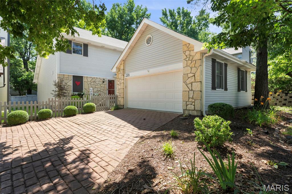Discover refined executive villa living where luxury, privacy, and a maintenance-free lifestyle converge in one of Chesterfield's most sought-after communities. Perfectly positioned on a quiet cul-de-sac, this exceptional residence offers a private oasis for effortless living. An open floor plan showcases rich hardwood floors, soaring beamed ceilings, abundant natural light, and timeless neutral decor. The impressive living room, anchored by a fireplace, flows seamlessly into the dining area, creating an elegant space for entertaining and everyday comfort. The well-appointed kitchen features custom cabinetry, stainless-steel appliances, and generous prep space, while the main-floor laundry adds everyday convenience. Retreat to the expansive primary suite, where private courtyard access offers a serene outdoor escape for morning coffee or evening relaxation. The attached two-car garage and unfinished lower level offer exceptional storage and endless possibilities for additional executive living space, including a media room, fitness studio, or guest suite. Your secluded courtyard provides the perfect setting for entertaining or unwinding, while resort-style community amenities are just a short stroll away, including a pool, clubhouse, fitness center, scenic lake, walking trails, and direct access to the Chesterfield Riparian Trail System. Ideally located near premier shopping, dining, healthcare, and major highways, this home delivers the sophisticated, lock-and-leave lifestyle today's executive buyer seeks.