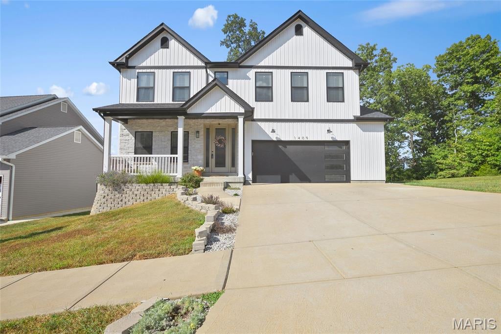 HUGE PRICE REDUCTION!! Your children will want this back yard.....you'll want this house!!  Looking for the space of new construction without waiting to build or spending thousands more after closing to finish the basement and backyard? Welcome to 1409 Burrwyck Lane, offering 3,087 sq. ft. of finished living space, 5 bedrooms plus a bonus room, 4.5 baths and upgrades already completed inside AND out. The open main level was made for gathering, featuring a beautifully updated kitchen with quartz countertops, oversized island, stainless appliances and designer finishes, opening to a spacious living area highlighted by a dramatic floor-to-ceiling stone fireplace. Upstairs, the spacious primary suite offers a beautifully updated spa-inspired bath and walk-in closet, while additional bedrooms and baths provide room for everyone. The finished lower level takes this home to another level with an additional bedroom, full bath and flexible bonus space, perfect for guests, a home office, gym, playroom or second living area. And then there's the BACKYARD! An expansive patio and custom covered pavilion with outdoor kitchen, built-in grill and smoker create an incredible space for BBQs, game days, birthday parties and evenings at home. The oversized driveway provides additional parking, and the backyard adjoins common ground for even more breathing room. Located in the Providence community with access to a neighborhood pool, playground, basketball court and common areas. At 1409 Burrwyck, the expensive projects are already DONE and a finished basement with plenty of storage space left. Outdoor entertaining space. Updated finishes. Over 3,000 finished sq. ft. Don't just compare the purchase price, compare what you're getting. Schedule your private showing and see the value for yourself! Motivated sellers- priced to sell FAST!