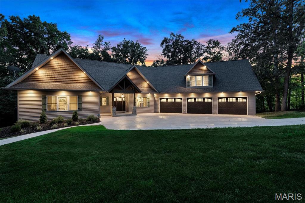 Experience the perfect blend of luxury and comfort in this stunning 6-bedroom, 5-bath estate set on nearly 8 acres of picturesque land. Every detail has been thoughtfully updated to impress. The remodeled kitchen is a chef’s dream, custom cabinetry, tiled backsplash, granite countertops, oversized refrigerator, and double ovens—ideal for entertaining. Step into the main floor living room, where vaulted ceilings create an airy atmosphere. French doors open onto an composite deck complete with an outdoor fireplace, perfect for gatherings or quiet evenings. The primary suite has coffered ceilings, his and hers walk-in closets, spa-inspired bathroom with double sinks, a tiled shower, and jetted tub. Above the garage, a 1,700 sq. ft. finished studio apartment, with a full kitchen and bathroom—ideal for guests or extended family. The walkout lower level offers additional space, with a spacious family room, three large bedrooms, and two full bathrooms. Car enthusiasts and hobbyists will appreciate the attached oversized, fully insulated three-car garage with pristine epoxy floors. The detached 5,000 sq. ft. insulated pole barn/workshop features concrete floors, three car bays, additional 1,000 sq. ft., partially finished office or apartment space. Properties like this are a rare find. Flexibility to run a business from home this estate delivers unmatched versatility and comfort. Take the next step toward making this unique residence yours—book your private tour today!
