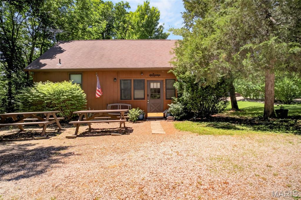 Looking for a place to escape, unwind, and make memories near Mark Twain Lake? This fully furnished cabin is ready for its next chapter. Spend your days on the water and your evenings relaxing in the hot tub, gathered around the fire pit, or exploring the many attractions just minutes away, including Blackjack Marina, Ray Behrens Recreation Area, Jellystone Park, boating, fishing, hiking, restaurants, and more. With established guest reviews, documented rental history, and furnishings included, the next owner can step in and start enjoying it from day one. Keep it as your personal getaway, continue renting it as an investment property, or enjoy the best of both worlds. Properties that offer location, lifestyle, and income potential don't come along every day. Come see what makes this one special. 
Also posted in LOBR MLS#3587884