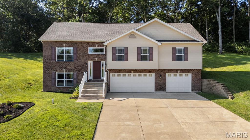 Welcome home to this charming 3-bedroom, 2.5-bath property nestled on 1.4 private acres in Hillsboro! Surrounded by nature and backing to mature trees, this home offers the perfect blend of peaceful country living and everyday convenience. Inside, you'll find a spacious floor plan featuring a versatile bonus room ideal for a home office, playroom, media room, or guest space, along with plenty of storage throughout. Car enthusiasts, hobbyists, and those needing extra workspace will appreciate the impressive 33' x 34' oversized garage. The generous lot provides ample room for outdoor entertaining, gardening, recreation, or simply enjoying the tranquil wooded setting. If you're looking for space, privacy, and functionality, this property is a must-see!