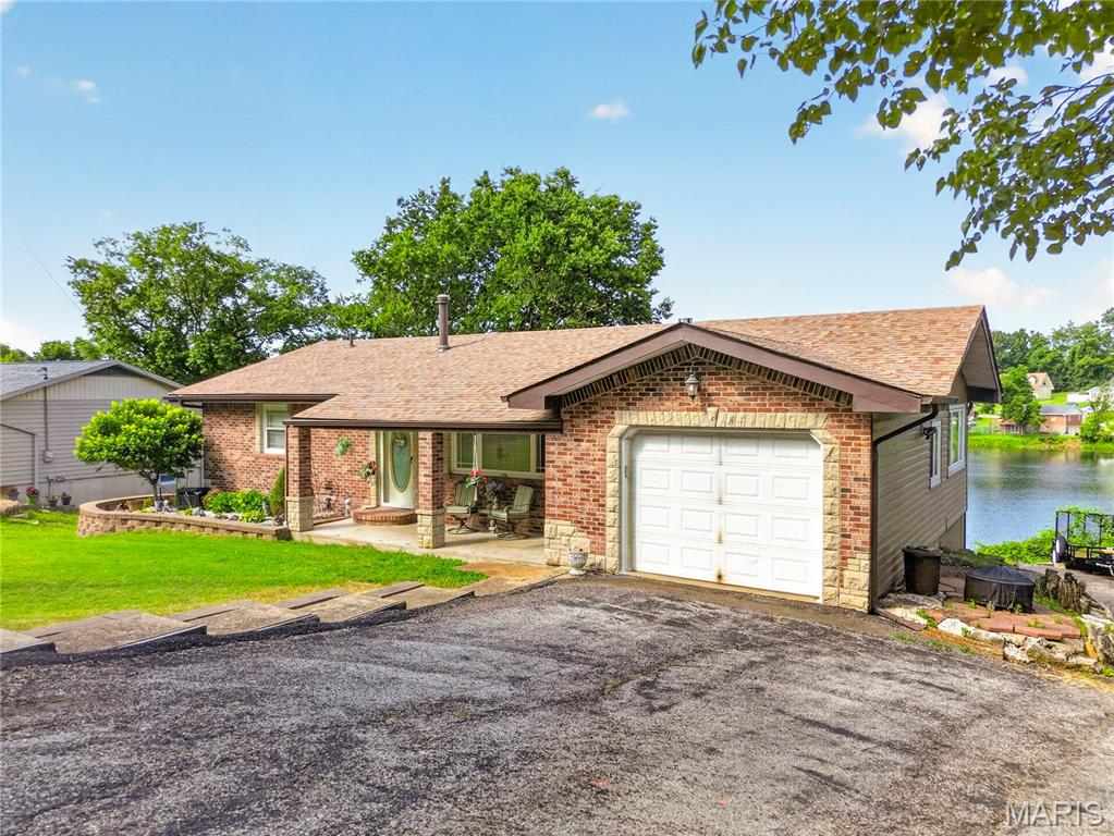 Enjoy lakefront living in this charming 3-bedroom, 2-bath ranch home! The main level features a spacious living room, two comfortable bedrooms, updated kitchen and full bathroom. The walkout lower level is partially finished and offers a large recreation area, third bedroom, and second full bathroom - providing plenty of additional living space for family and guests. Step outside onto the expansive deck and take in the beautiful lake views, perfect for relaxing or entertaining. Additional features include a long driveway with ample parking, a smoke house, and a recently updated sewer system for added peace of mind. Whether you're looking for a full-time residence or a weekend retreat, this waterfront property offers the perfect combination of comfort, functionality, and scenic beauty.
Property to be sold in As-Is condition