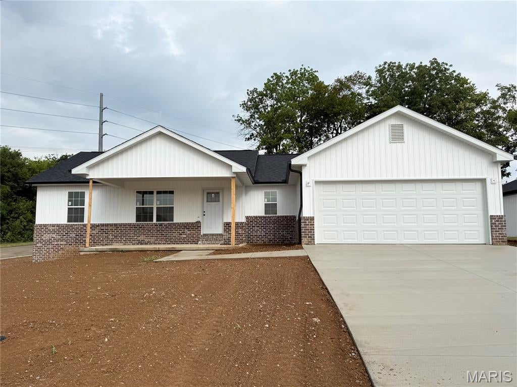 Large Corner lot in McKendree Crossing Neighborhood - yard will be sod! Fantastic location close to Cape/Jackson/Schools/I-55. Nothing beats the smell of BRAND NEW! Vaulted ceilings, with living room, kitchen and dining opening to each other giving extra space and room + that also opens to a partially covered deck. The split bedroom concept gives privacy, primary bath features walk-in shower and double vanity with large walk-in closet. Stylish kitchen with center island, solid surface countertops and stainless steel appliances. No carpeting on the main floor with luxury vinyl flooring all through-out. The full walk-out basement offers a pre-designed layout for later expansion. Photos are not of this listing *photos are another house with same floor plan to show finishes only. Some changes may apply.