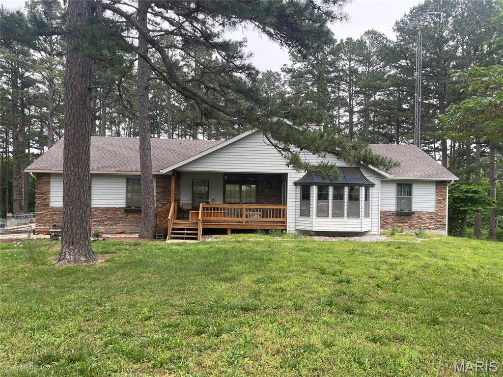 Hard to find property on Hwy 72 about 5 minutes from Salem.  Main level features a nice living room with a wood burning fireplace and bay window area, primary bedroom hosts two closets with one walk-in and a full primary bathroom.  French doors that lead from the bedroom to the covered front porch.  Two additional bedrooms and a second full bath.  Kitchen with a small bar and a separate dining area with a patio door leading to the back deck.  Go to the basement for your large family room with a sliding door leading to the patio, sitting area with a fireplace, a 4th bedroom that is non conforming as it does not have an egress window, laundry room, storage closet, third full bathroom and a nice, oversize garage area.  Let's not forget the workshop.  It is 45X60.  Red iron frame with metal siding and roof, two 12' doors and one 14' door, concrete floor, bathroom, office area, loft storage, 220/110 electric and propane radiant heat.  This building has its own lagoon.  All sitting on 6.6 +/- acres with a circle drive.  The propane tank that services the house is owned and the propane tank that services the shop is leased.
