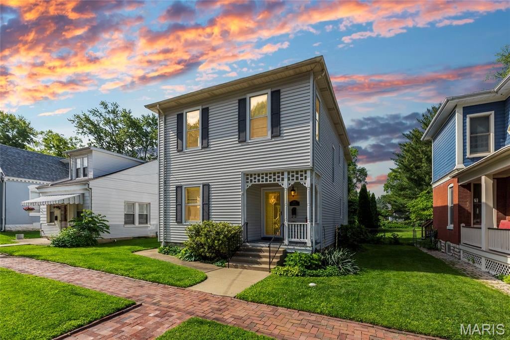 Own a piece of St. Charles history! Built in 1894 and tucked along historic Clark Street, this charming home offers the character and craftsmanship of another era paired with thoughtful updates for today. Just a short walk from Historic Main Street, enjoy easy access to local restaurants, shops and all the energy of one of St. Charles’ most beloved destinations. Unlike a cookie-cutter neighborhood, the surrounding streets are filled with distinctive homes, mature character and plenty to discover on an evening stroll.

The owners have taken special care to enhance the home while respecting its original charm. A rebuilt, insulated and waterproofed front porch stays true to the original architecture, while refinished hardwood floors and a professionally refinished staircase and updated kitchen add warmth inside. 

Outdoors, a herringbone brick patio and walkway, refreshed landscaping and garden areas create an inviting backyard retreat. The upstairs bath has been thoughtfully updated while retaining its original cast-iron tub, and the home's original windows have been repaired and reglazed as needed. Additional improvements throughout the kitchen, pantry, baths and exterior add everyday function without sacrificing the character that makes this home so special.

Historic. Walkable. One-of-a-kind. This is the kind of St. Charles home that simply can't be recreated.