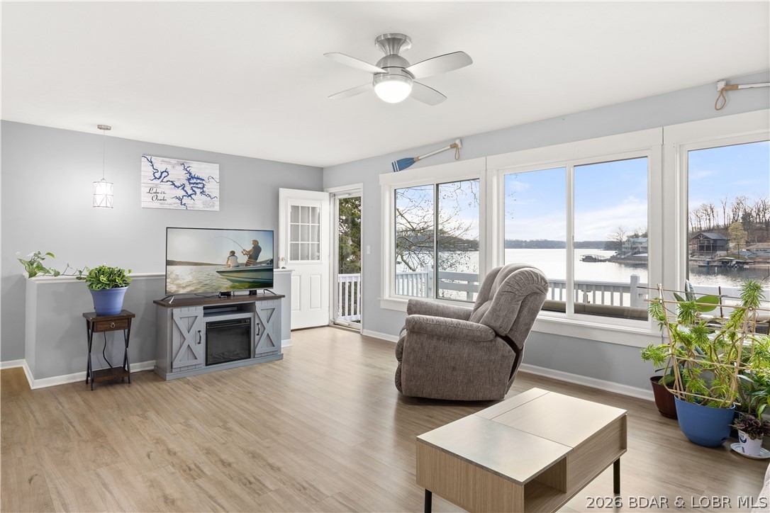 Discover the ultimate lakefront retreat with this stunningly remodeled 4-bedroom, 2-bathroom ranch, perfectly positioned at MM 5.5 in Lick Branch Cove. This residence offers a rare combination of BIG views and incredible DEEP water (25–30 ft), providing an exceptional environment for boating and swimming alike. Every inch of this home has been polished to perfection. The interior boasts a comprehensive remodel featuring updated flooring, contemporary lighting, and high-end windows that flood the space with natural light. The gourmet-inspired kitchen and baths shine with new cabinets and sleek countertops, offering a "fresh and clean" aesthetic throughout. Step outside to your private aquatic playground: a 2-well dock (10x28 & 8x8 PWC) equipped with a boat hoist, PWC hoist, swim platform, and wet steps for easy water access. Situated in a peaceful neighborhood on a well-maintained road, the property provides ample parking and effortless access to the shoreline. Whether you are looking for a tranquil full-time residence or a high-energy vacation getaway, this lakefront treasure is move-in ready. Bring your tape measure and see the depth for yourself—this is the one!