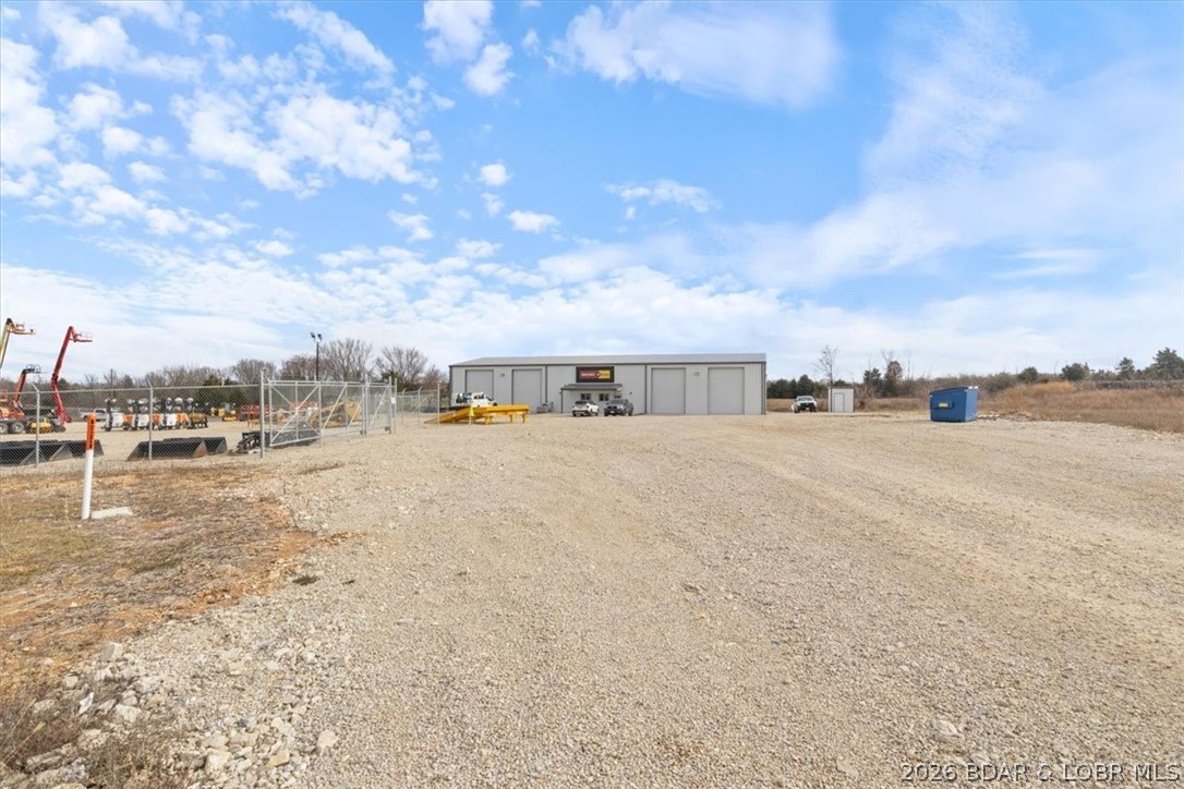 This property features 2 recorded lots sold together offering unmatched value and versatility that even your accountant would be excited about. Building is fully leased at $5k per month with 1.5 years remaining on the lease. It also boasts a $400K build out for top tier functionality.  A shared well and septic system means low maintenance costs so you can focus on building your empire rather than worrying about getting your hands dirty. With flexibility in future use or development the possibilities are as endless as a Netflix series.