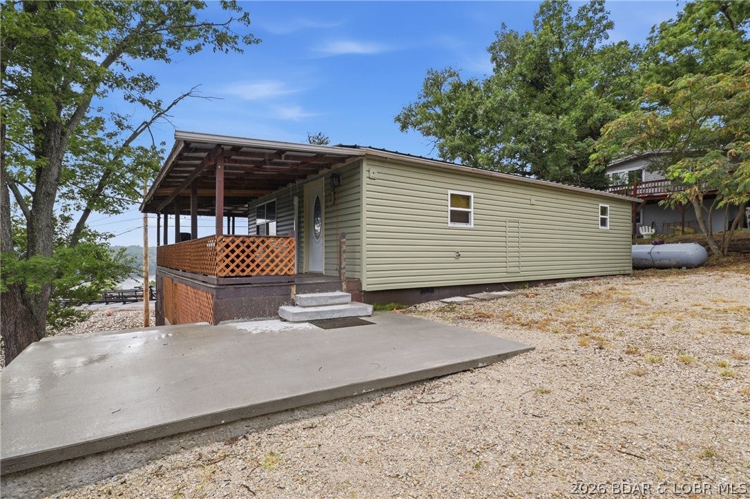 Enjoy the best of lake life in this charming 2-bedroom, 1-bath home featuring beautiful lake views and a lake access easement. Just a short walk away, your included 10’ x 24' boat slip makes getting out on the water quick and convenient. Located in the heart of Osage Beach, this property offers the perfect combination of relaxation and convenience. Spend your days at the community pool, take a stroll to your boat, or enjoy easy access to shopping, dining, entertainment, and all the attractions the Lake of the Ozarks has to offer. Whether you’re looking for a full-time residence, weekend getaway, this home offers an exceptional opportunity to experience the lake lifestyle with desirable amenities in a prime location. Don’t miss your chance to own this affordable lake retreat! 10x24 boat slip