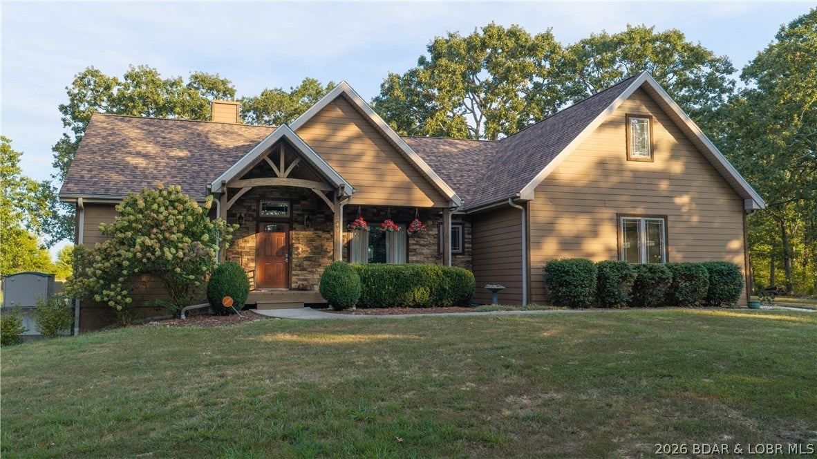 Space, comfort, and room to grow on 3 flat acres in Linn Creek! This custom home offers 4 bedrooms (one nonconforming), 2.5 baths, and 4,162 total square feet, including a 1,934-square-foot unfinished walkout basement. Enjoy convenient main-level living with vaulted ceilings, hardwood floors, and a floor-to-ceiling gas fireplace overlooking the open acreage. The kitchen features granite countertops, stainless steel appliances, an automatic hot water dispenser, abundant cabinetry, and a large island perfect for gathering. The spacious primary suite includes a private bath with dual vanities and a beautiful walk-in shower. Two additional main-level bedrooms share a Jack-and-Jill bath, while the upstairs nonconforming fourth bedroom offers flexible space for guests, hobbies, or an office. The unfinished lower level is stubbed for a bathroom and provides excellent storage and potential for additional living space. Outside, the level acreage offers room to garden, play, or simply enjoy the peaceful surroundings. Schedule your private showing and explore the possibilities! SELLERS ARE ACCEPTING BACK UP OFFERS