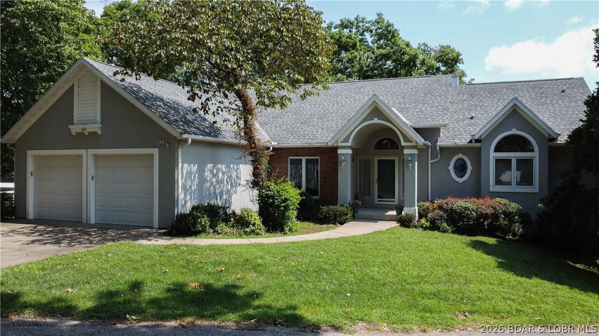 Extremely gentle lakefront, 125 feet of shoreline, and views for days! Welcome to 643 Heron Estates Drive, ideally located off highly desirable Sellers Road. This spacious lakefront home sits on a nearly level lot, offering rare, easy access from the home to the water.

Inside, the open main level features abundant natural light, multiple gathering spaces, a well-appointed kitchen with generous cabinetry, and direct access to a large deck overlooking the lake. The home offers 5 comfortable bedrooms, multiple living and entertaining areas, a private primary suite, a jetted tub, main-level laundry, and plenty of room for family and guests.

Mature trees, attractive landscaping, an attached two-car garage, and a covered dock with two boat lifts and a PWC lift complete the package. Whether you are searching for a full-time residence or weekend retreat, this property delivers exceptional lake views, amazing waterfront, and the relaxed Lake of the Ozarks lifestyle buyers are looking for.