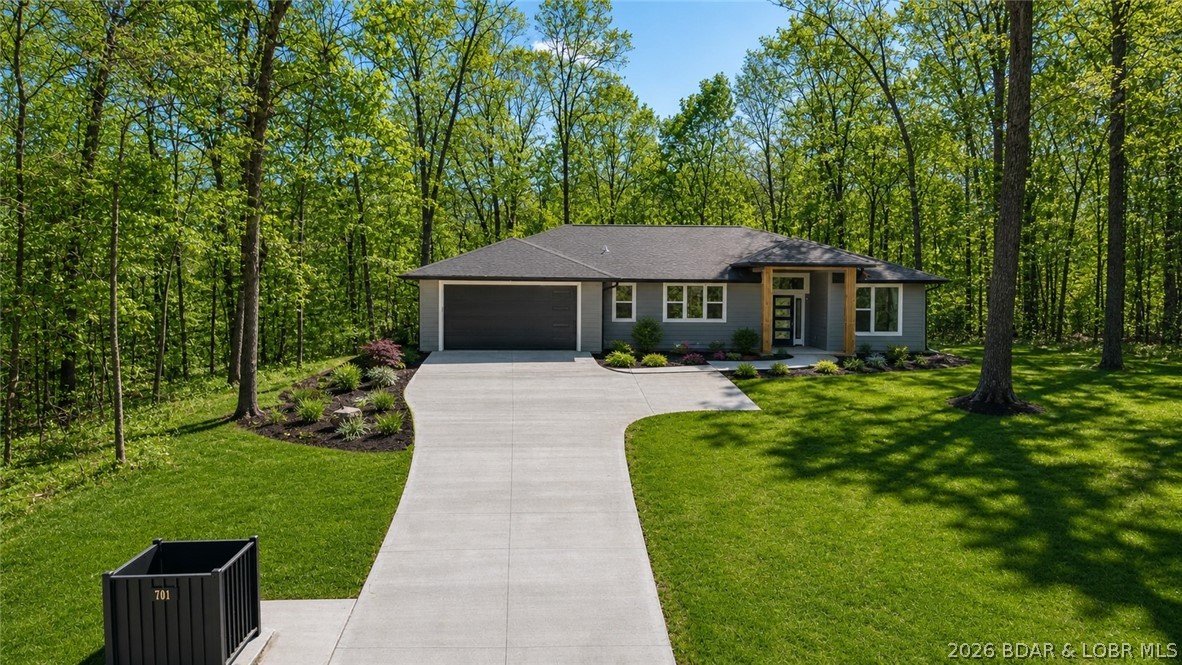 Enjoy main-level living in the highly sought after Porto Cima community. This 3 bedroom, 2 bath home features an open concept floor plan ideal for both everyday living and entertaining. The kitchen offers a modern design with under cabinet lighting, stainless steel appliances, walk-in pantry and flows seamlessly into the living and dining areas. The master suite includes a custom walk-in closet, plus an oversized shower with gorgeous floor to ceiling custom tile. The 2 additional bedrooms provide flexibility for guests or a home office. This all-electric home also features an on-demand water heater for added efficiency and convenience, and a water softener. Not only is this home located on a quiet and serene street in Porto Cima, the POA owns the lot behind the home which provides a private wooded setting. **BUILDER IS PROVIDING AN ALLOWANCE so you can select your own custom master closet shelving system, master shower door and custom kitchen pantry shelving. (see attached details).**