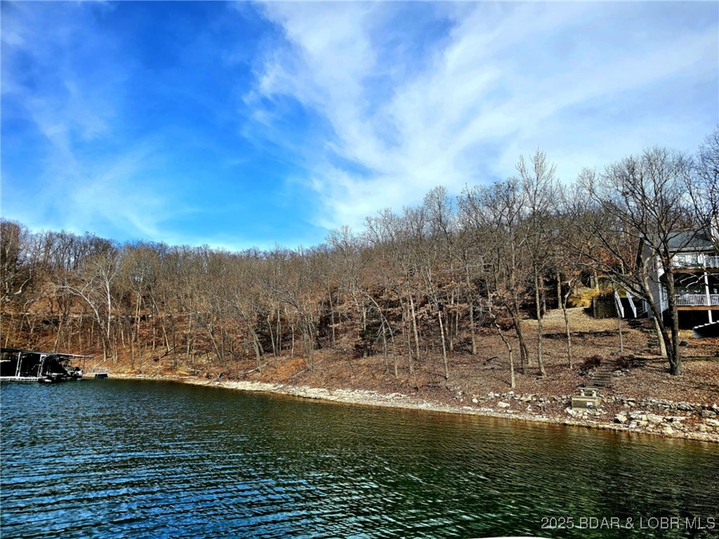 LOCATION, LOCATION, LOCATION! 75' of LAKEFRONT, quiet cove, and blacktop roads, makes this property the perfect spot to build your dream home! Conveniently located to shopping, entertainment, restaurants, water bars and activities. Less than 10 minutes to the popular Bagnell Dam Boulevard. Four Seasons is a highly sought after community with numerous amenities that include: 4 pools including an aquatic center, tennis, walking trails, fitness center, campground, three interior lakes, boat storage, community center, fishing, boat ramps, community events, member discounts and more!