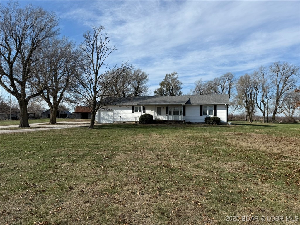 195 m/l Acres – Highly Productive Farm with Highway Frontage! Discover this impressive 195-acre property featuring over ½ mile of Highway 65 frontage and a charming 3 bedroom, 1 bath ranch home. Ideally located just 11 miles south of Sedalia and 15 miles north of Truman Lake, this farm offers strong agricultural income plus excellent long-term potential. Approximately 132 acres are currently in row-crop production, with an additional 43 acres in grassland—much of which could be converted. The property offers excellent building sites and outstanding exposure for a variety of future uses including residential, commercial, or industrial development. The ranch home features a large, open kitchen and dining area, a 1-car attached garage, and an unfinished basement that could easily be transformed into additional living or entertainment space. Multiple detached outbuildings provide ample storage for hay, equipment, vehicles, and all your farm or hobby needs. Family farm-first time on the market!