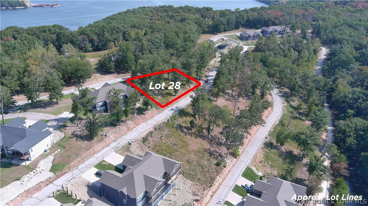 Amazing opportunity to purchase a lot with a seasonal water view in a well established subdivision. This lot will allow you to build a private home or a villa in The Villas of Tuscany Subdivision. This location is one of the most ideal lots within the subdivision. Amenities are already in place with water & sewer, internet access through Spectrum. You will enjoy the amazing pickle ball court, community pool & bath house, dog park area, and golf cart path down to the community docks. Note- proposed structure shall be approved by Architecture Review Committee and landscaping will also need to be approved. (Subdivision will maintain landscaping of home, just as a Villa).