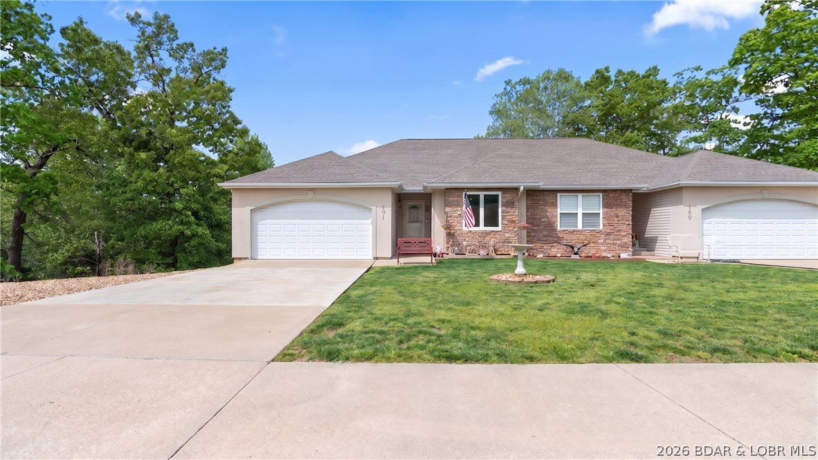 Spacious and well designed 2 level villa offering 4 bedrooms, 3 full baths, and a 12 x 30 boat slip. Enjoy two separate living areas, giving you flexibility for relaxing or hosting guests. The open main level features vaulted ceilings, a comfortable living room, and a functional kitchen equipped with new Kenmore Elite appliances, granite countertops, and updated cabinetry, creating an easy flow for everyday living. The primary suite includes a fully remodeled ensuite with an onyx shower and walk in closet. The lower level offers a second living room along with additional bedrooms, providing great separation for guests or family. Numerous updates include newer HVAC, roof shingles, LVP flooring, water heater, and Andersen Windows for added efficiency and peace of mind. Backing directly to a beautiful state park, the property offers privacy and a peaceful natural setting. Complete with a 2 car garage, this villa delivers convenience, space, and low maintenance living. Quarterly assessments include dock, pool, water, sewer, trash, clubhouse, and more! Ideal as a full time residence, vacation home, or investment opportunity. Golf cart available for purchase.