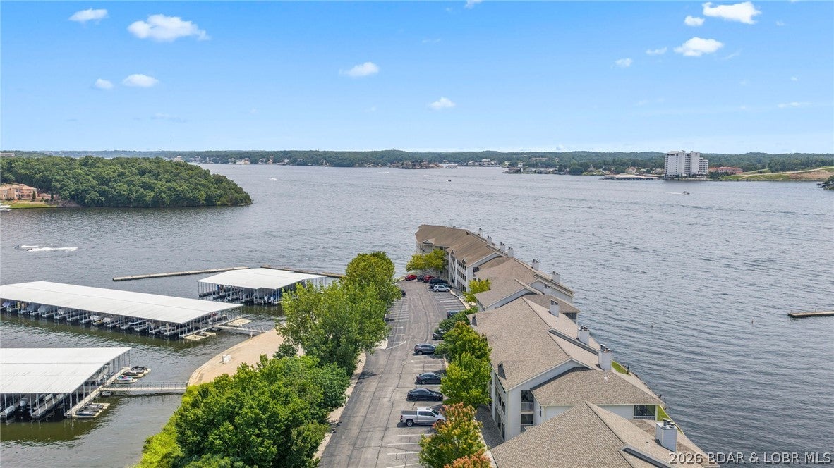 Set within Regatta Bay at the 12 Mile Marker, this spacious 3-bedroom, 3-bath condo offers an easy, refined lake lifestyle with main-level walk-in access and no steps. Recent paint and flooring updates give the interior a fresh, polished feel, while the fully furnished setup makes the property move-in ready.

Large windows in the living area, primary suite, and primary bath bring in abundant natural light and frame the lake setting. The split-bedroom floor plan provides added privacy, with a generous primary suite featuring French doors to the private bath, plus a spacious guest bedroom with its own en-suite bath.

The open living, dining, and kitchen areas are designed for both relaxed everyday use and entertaining, with access to the outdoor living space. An included 14x36 boat slip with lift adds exceptional convenience for boating at Lake of the Ozarks. Conveniently located on Horseshoe Bend, just minutes from popular waterfront dining and entertainment, the Bagnell Dam Strip, and several of the Lake’s premier golf courses.