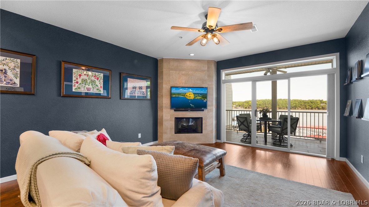Situated in one of Osage Beach’s most desirable gated condominium communities, this beautifully updated lakefront unit is all about effortless luxury and Lake views. Start each day with unforgettable sunrise panoramas stretching across the water, then unwind in the evening from your private screened-in deck as boats cruise by. Inside, this impeccably maintained condo has been freshly painted and is move-in ready with with updates that include Armstrong flooring, unique tiled fireplace wall, granite kitchen countertops, a designer tile backsplash, and updated stainless steel appliances. The complex itself has been exceptionally maintained, with major improvements including new wavebreaks, roofs and modernized elevators in 2024, adding peace of mind for the next owner. Elevator access makes getting to and from the unit a breeze, while the no-nightly rental policy helps preserve the quiet, upscale atmosphere for all owners. Ready for lake days? Your 12x36 boat slip with included 10,000 lb lift and remote is waiting for you to drop the boat and GO!  Top it all off with a sparkling saltwater pool, and you’ve found the definition of easy lake living at Stoneledge.  Check it out TODAY!!