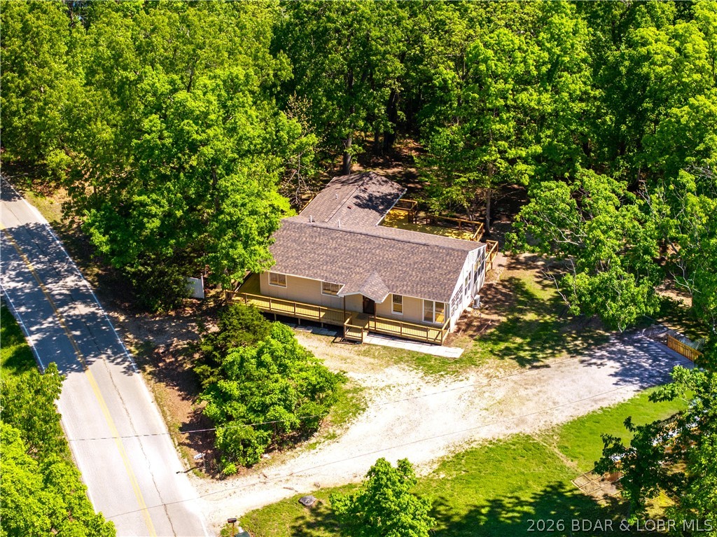 Completely remodeled and move-in ready, this Rocky Mount home offers the perfect blend of quality upgrades, functional living & a great location—just 10 minutes from the Bagnell Dam Strip and 15 minutes to Osage Beach. This 3bed/3bath, approx. 1,700 sqft home features main level living with vaulted ceilings, abundant natural light & a spacious sunroom off the living room. One of the standout features is the newly rebuilt oversized deck off the back of the home that wraps around to the front, creating excellent outdoor living space. Major upgrades include a new roof, heat pump HVAC, new 1,000 gal septic tank, remodeled kitchen with new appliances, fresh paint, updated fixtures, relocated electric panel, multiple new windows & new crawlspace vapor barrier. Primary suite includes a private bath with walk-in shower & soaking tub. Exterior offers a flat backyard, circle driveway & additional space beside the home ideal for a future shop or garage. A rare turn-key opportunity with extensive improvements already completed!