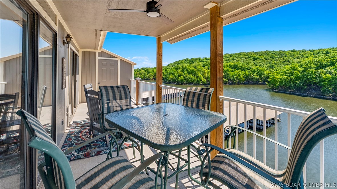 Looking for lake life without all the maintenance? This top floor, turn-key condo has vaulted ceilings and your own boat slip located just outside the unit. The Lazy Days complex gives you access to two pools, a playground, BBQ pavilions, a boat ramp, trailer parking, a dog park, and a game area - everything you or your guests need to enjoy the lake. Nightly rentals are allowed, giving you the ability to use it as a personal getaway, as an investment property, or both. Located in a calm, no-wake cove, you can swim directly off the dock and enjoy the water without the heavy boat traffic. Surrounded by Lake of the Ozarks State Park, your natural views are protected, ensuring privacy and that your beautiful scenery won’t change. Plus, you’re located within the new Lake of the Ozarks Shootout location, keeping you close to one of the lake’s biggest attractions. The complex is also located down the road from Harley Davidson, offering an excellent opportunity for renters during bike fest - another one of the lake's biggest attractions. This condo is low maintenance, has strong rental potential, and offers easy lake access. Come see it for yourself!