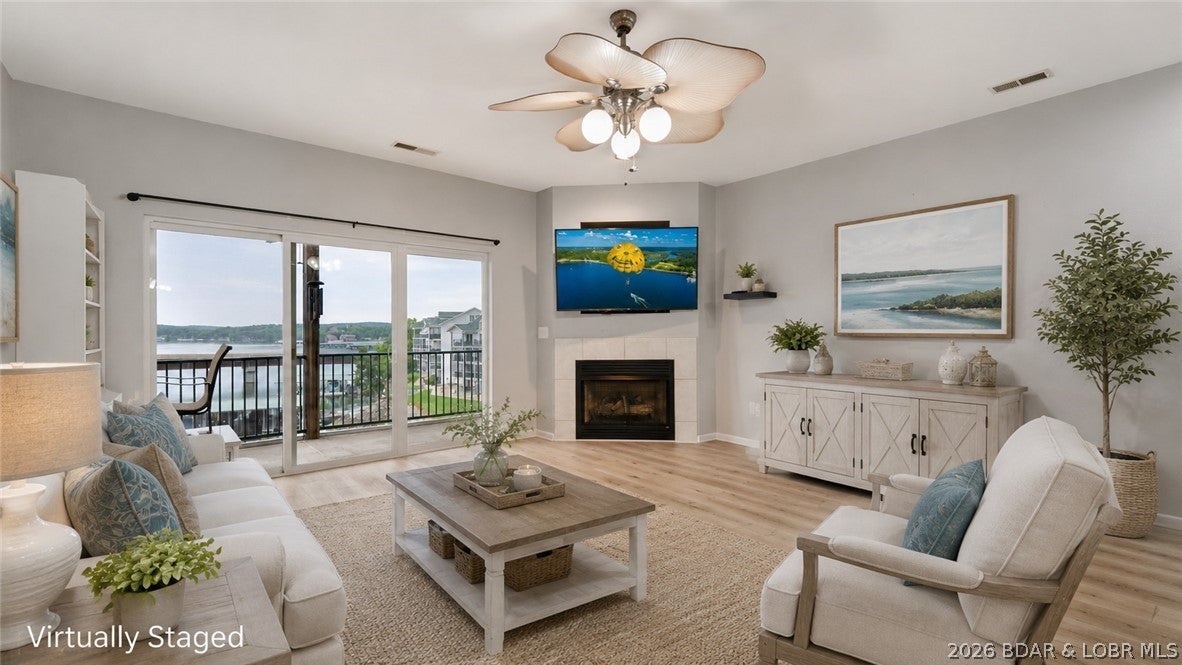 BEAUTIFULLY UPDATED WALK-IN CONDO with breathtaking views of the Big Niangua at the 13 MM! This spacious 3-bedroom, 2-bath unit offers effortless lake living with LVP flooring throughout and a beautifully updated kitchen featuring high-end KitchenAid stainless steel appliances. Enjoy panoramic water views from the living area, primary suite, and expansive deck overlooking the pool. The walk-in location provides the most convenient access, and the elevator is only steps away, making trips to the dock and pool a breeze. The included 12x32 boat slip features a remote-controlled hoist, so you're ready to hit the water. This secure gated community offers generous parking, multiple pools, and a dog park, with an optional garage available for additional storage. Conveniently located by land and water near popular waterfront restaurants, shopping, hiking, and outdoor recreation, plus adjacent to Old Kinderhook and Lake Valley Golf Club for golf enthusiasts. Whether you're searching for a full-time residence, weekend getaway, or investment property in a complex known for strong rental demand, this condo delivers the perfect combination of comfort, convenience, and exceptional location.