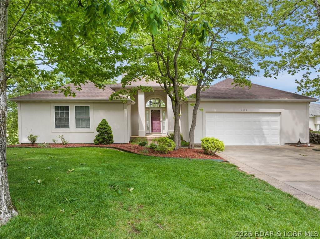 Custom built Home with great Lake View.  Covered Porch has Entry to the Living Room with lots of Lake View Windows, Fireplace and 12 Ft Ceilings.  Gourmet Kitchen has Custom Cherry Cabinets, Wine Cooler, Stainless Steel Appliances, Gas Chef Oven, Electric Oven, Pantry w/roll-out Shelving and nice Work Island.  There is a Dining Room off the Kitchen with Lake View Windows that leads out to a large open Deck with great Lake View of the Osage 33 Mile Mark.  The Master Bedroom/Bath has a Jetted Tub, Walk-In Shower and Walk-In Closet.  Downstairs is a large Family Room with a Kitchen and outside covered Deck.  There is an attached 2-Car Garage and level Parking.  The 3-Well Concrete Dock has a Swim Platform and you can take the Steps to the Dock or use the Gated Tram.  The Subdivision has a lot of nice Homes and is a great location on the Lake.