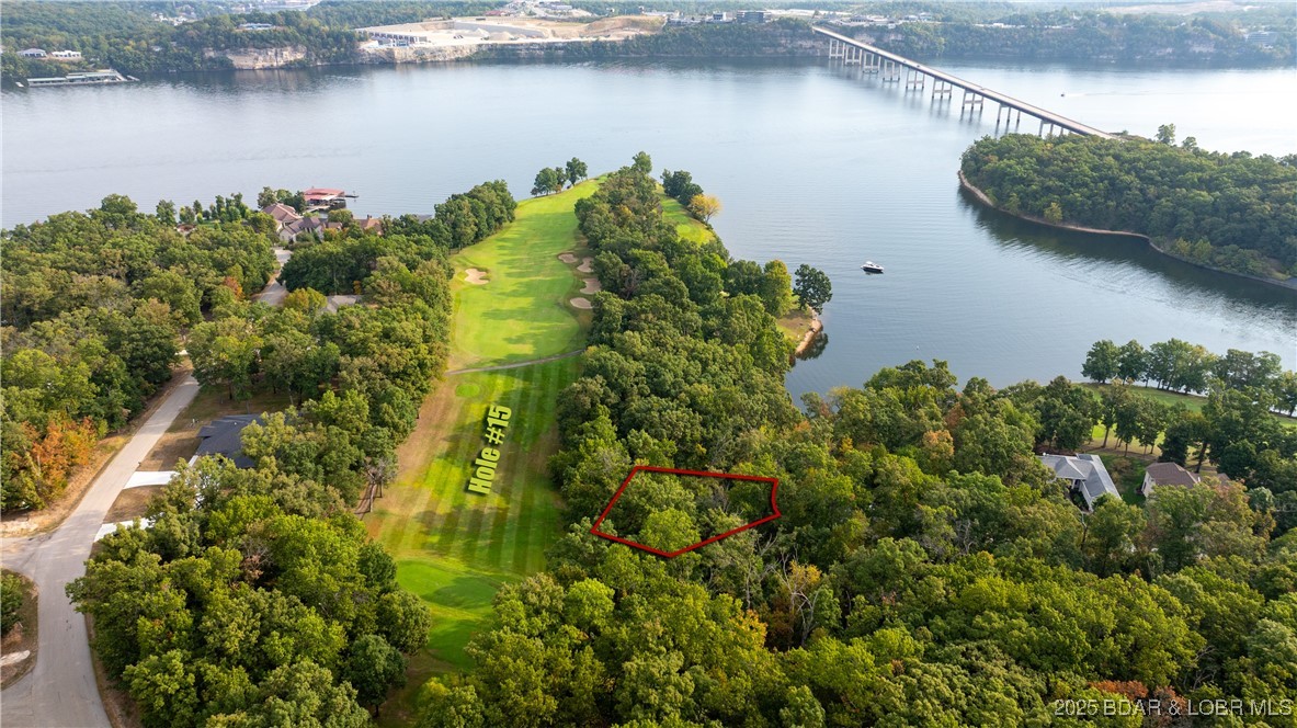 Have you ever wanted to live on a golf course? Well look no further! This .30 acre lot sits right on the signature 15th hole at The Club at Porto Cima. Situated in an upscale area and at the end of a cul-de-sac, this lot provides the perfect opportunity to build your dream home or sit on an investment as the area continues to grow. The area is quiet, but you can quickly get to Osage Beach dining and shopping within 10 minutes. Water, sewer, and electric are available as well as Porto Cima's amenities. Get a golf membership or sign uo to get on the list for Porto Cima's marina nearby. Come check out this great opportunity today!