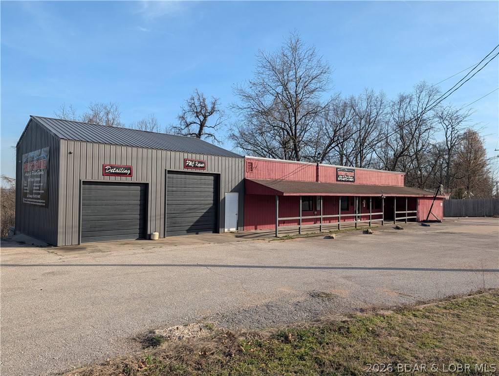 Opportunity awaits for this property located at the busy intersection  of Hwy EE (known as Resorts Road) and State 7 Hwy near Hwy 5. Good exposure with  570  ft m/l  Hwy road frontage.  The paved parking lot spans from 2 separate driveways entrances connected to  main road for good visibility & access at 630 North State Hwy 7, Camdenton, MO.  This is a great location for any business venture. It has been a mechanic shop, car dealership & restaurant-bar. If you want to open a restaurant see what the seller is including. This building is  1790 sq ft area m/l  features covered patio, bar area, 3 half bath, shower room & office.  Attached to this  building  is a 30x25 metal shop built in 2016 with 2  garage doors  & concrete floor.  The commercial well is a great asset to the property. All this for sale consisting of 2 parcels  of  nearly 2 acres. The 2nd address is 594 North State Highway 7  with a 24x40 shop building, concrete floor and electric for more projects just under an one and half acre. This property provides lots of possibilities  for a new owners investment also the owned billboard already in place for advertising. Take a look  to see if this  is the property to invest in!