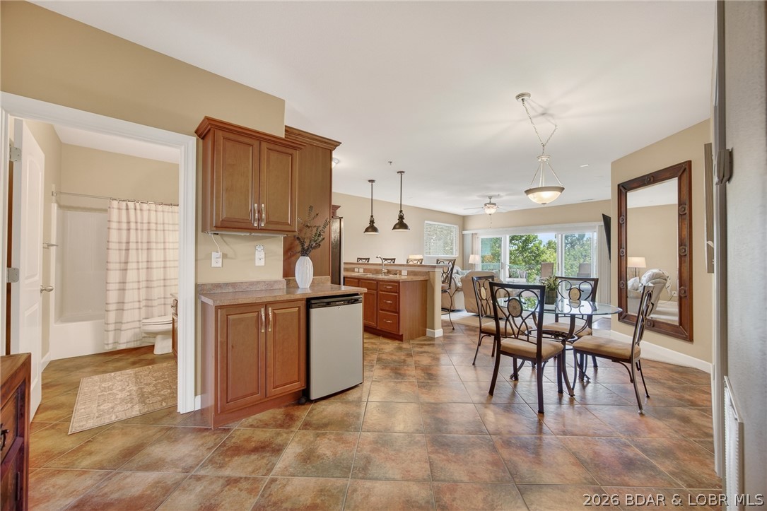 Sunset Palms stands apart from the crowd. This smaller, self-managed, non-rental community sits right on Highway 5 — no five miles drive down a lake road, just pull in and you're home. Gated, well-maintained, and built in 2006 with quality construction, the pride of ownership here is visible the moment you arrive. This 3BR/2BA end unit offers 1,447 sq ft of single-level living with a fireplace, jetted tub, ceiling fans, and all appliances included — plus washer and dryer. The 12x36 covered slip (Dock 9, Slip 4) comes with a 4,500 lb. boat lift, both included in the sale. A garage directly in front of the unit is available for an additional $40,000.One level up from parking with elevator access. HOA at $922.86/quarter covers cable, dock, road, sewer, trash, and water — among the lowest assessments lakeside for what you get. Community amenities include a pool, hot tub, pickleball, and clubhouse. Whether you're looking for a full-time home or a relaxed lake retreat, this one delivers. Pre Listing Inspection and One Year Home Warranty