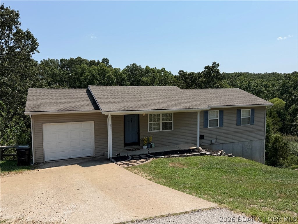 Affordable housing in Camdenton MO. This is a very clean 3 bedroom 2 bath ranch home with 924 sq ft of an unfinished walk out basement.  The seller has replaced the back deck boards and the home offers a full attached garage making this move in ready.  Close to town but offers privacy out the back and extra parking.  Come be apart of the Midwest Coast, Investment Opportunity, or your New Home with room to expand.