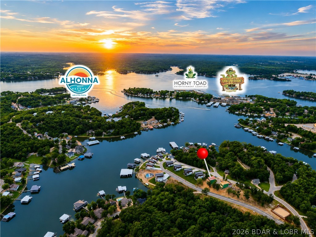 Welcome to THE COVE - The Newest Modern Luxury Home Development at the Lake of the Ozarks! Unlike most new construction at the Lake, homes at The Cove will feature ultra modern architecture & design, 4 beds/4 bath home right under 3000 SF with attached 2 car garages, high end finishings, incredible indoor/outdoor space perfect for entertaining & so much more. The development will feature a combination of 20 waterfront & 2nd tier homes w/ amenities including a community pool, walking trail, community dock & manicured landscaping. The 2nd tier homes have incredible views with sunsets you have to see to believe, PLUS- 14’x40’ & 12’x32’ slips available in the community dock to house your boat so you can enjoy the Lake to the fullest! Located down Horseshoe Bend & on the 8MM by water, these homes will offer tons of privacy while still being close to some of the most popular dining & entertainment the lake has to offer!