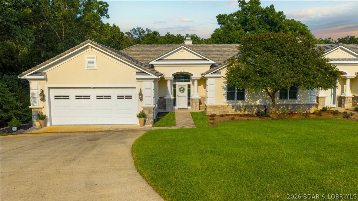 LAKE OF THE OZARKS - Welcome to Magnolia Point—undisputedly the crown jewel of townhome communities at the Lake of the Ozarks. Situated in highly coveted Porto Cima, this spectacular 4-bedroom, 3.5-bathroom residence offers an elevated lake lifestyle with premier craftsmanship and modern design. Step into a completely updated interior featuring the sleek, modern white & crystal finish palette. Bright, light-filled living spaces pair seamlessly with upscale fixtures, crisp clean lines, and luxury finishes throughout. Designed for effortless entertaining and comfortable family living, offering 4 generous bedrooms and 3.5 luxury baths. Includes a sought-after 14x48 boat slip in the community dock—located in the peaceful, highly desirable Family Cove—along with two PWC ports. Enjoy calm water, easy docking, and quick access to main-channel action.
Nestled in a quiet, prestigious neighborhood surrounded by world-class amenities, golf, and dining options. Whether you're relaxing on the deck, hosting guests in your showstopping contemporary kitchen, or spending the day out on Family Cove, this townhome represents the pinnacle of maintenance-free luxury living at the Lake.