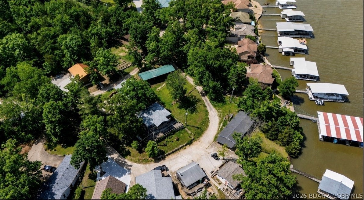 Prime lake view vacant lot located at the 36 Mile Marker in Sunrise Beach, offering stunning views of Lake of the Ozarks. This build-ready property is perfect for your dream home or vacation getaway. Enjoy peaceful surroundings with easy access to nearby marinas, restaurants, and lake activities. This property also has access to a boat ramp directly in front of your property making it seamless to get out on the water. Don’t miss this rare opportunity to own a piece of paradise and build to suite your needs.