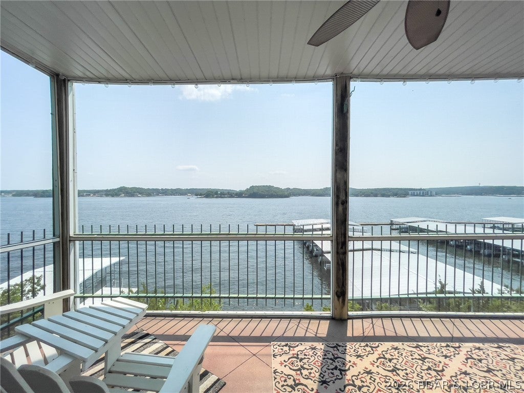 RARE and PRIVATE, 4 bedroom, 4 bath, 2 level, end unit condo at one of the most popular developments at the Lake of the Ozarks! Great location just a few minutes from HWY 54 and Bagnell Dam, you'll have a front row seat to the Lake Race and a 6 mile panoramic view that beats all! This wonderfully furnished waterfront condo has 3 bedrooms, 3 baths, kitchen, living, dining and laundry all on the main level and BONUS lower level family room and with ADDITIONAL bedroom and bath. Enjoy upper and lower lakefront decks as you see water, water, everywhere! This condo includes furniture, 12 X 32 boat slip! Updated with new stainless appliances and wood flooring. Garage available for additional purchase. Perfect location just minutes from Osage Beach by land and great location by water close to many lakefront restaurants. Great income potential with the amazing views and closeness to all the attractions. this is a must see!
