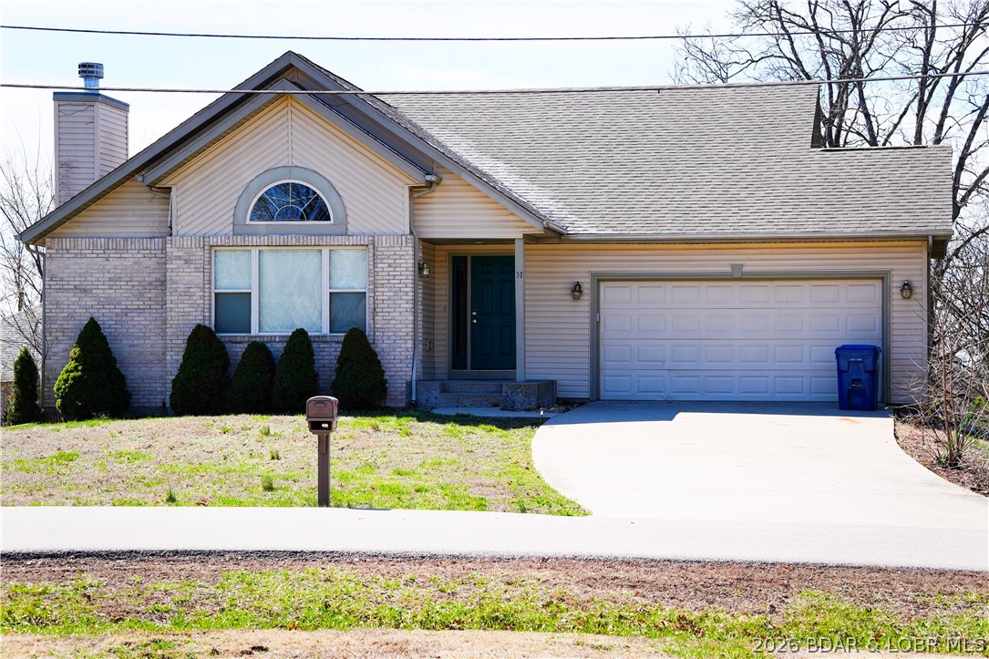 Charming home with walk-out basement in the heart of Camdenton! The main level welcomes you with a bright, open living room featuring vaulted ceilings and a classic brick fireplace. The kitchen offers tile flooring and included appliances, flowing into a light-filled dining area with a beautiful bow window and access to the sundeck—perfect for relaxing or entertaining.

Ideally located near restaurants and shopping, this home is a fantastic opportunity for families seeking comfort, convenience, and small-town charm!