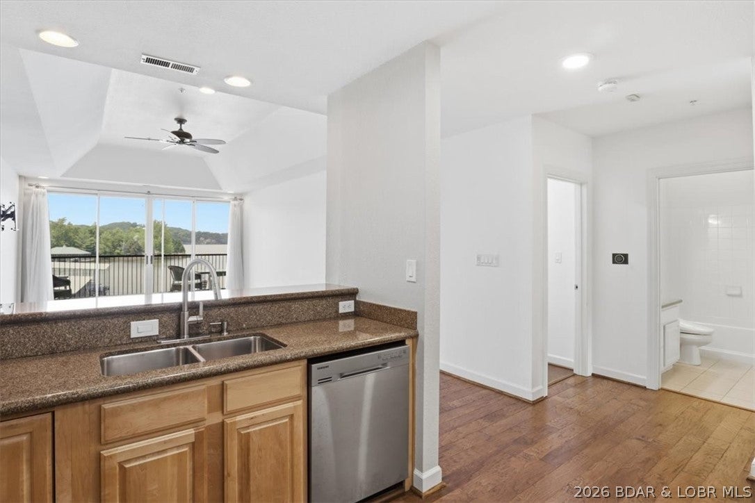Live the resort lifestyle at Marina Residences in the fabulous Old Kinderhook! This 2-bedroom, 2-bath condo is the perfect blank canvas—vacant and ready for you to bring your own personal style to the décor and furnishings. Enjoy lake views of the Big Niangua and the 11-mile marker, all while taking advantage of Old Kinderhook’s unmatched resort-style amenities. Spend your days relaxing by the outdoor pools, playing pickleball or basketball, and letting your furry friend run at the dog park. In the summer, they offer sandy beach volleyball, and in the winter, you can enjoy the unique charm of the ice-skating rink right within the community. Dining is effortless with The Trophy Room and The Hook Café just minutes from the complex, making it easy to grab dinner, drinks, or brunch close to home. The building also features an elevator for convenient access, plus an additional private storage room in the garage for all your lake toys and extras. Whether you’re searching for a full-time residence, weekend retreat, or investment opportunity, this condo offers the perfect opportunity to enjoy the incredible Lake of the Ozarks lifestyle in one of the area’s most sought-after communities.