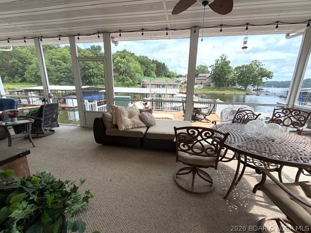 Don't hesitate for even a minute. Whether you're looking for a full-time residence or a weekend retreat, this home offers the perfect blend of tranquility, comfort and waterfront recreation. Escape to the peace and beauty of lakefront living in this inviting home nestled on a quiet, low-traffic road. Wake up to breathtaking water views and spend your days enjoying your private boat dock, perfect for boating, fishing, or simply soaking up the lake lifestyle. The spacious open deck is ideal for entertaining, grilling, or watching unforgettable sunsets, while the enclosed patio offers a comfortable space to relax year-round, rain or shine. The floorplan offers the ideal living area lakeside & bedrooms on upper level for enjoying privacy & a peaceful nights rest. The fully equipped kitchen will be a welcoming addition when all your friends decide to stop by for a bite. Park your boat & personal watercraft lakeside in your dock and your vehicles in the 2 car garage. We'll be waiting for your arrival.