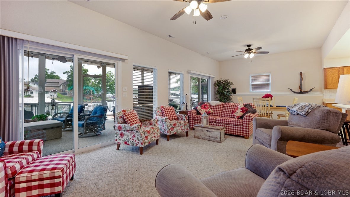 Don't hesitate for even a minute. Whether you're looking for a full-time residence or a weekend retreat, this home offers the perfect blend of tranquility, comfort and waterfront recreation. Escape to the peace and beauty of lakefront living in this inviting home nestled on a quiet, low-traffic road. Wake up to breathtaking water views and spend your days enjoying your private boat dock, perfect for boating, fishing, or simply soaking up the lake lifestyle. The spacious open deck is ideal for entertaining, grilling, or watching unforgettable sunsets, while the enclosed patio offers a comfortable space to relax year-round, rain or shine. The floorplan offers the ideal living area lakeside & bedrooms on upper level for enjoying privacy & a peaceful nights rest. The fully equipped kitchen will be a welcoming addition when all your friends decide to stop by for a bite. Park your boat & personal watercraft lakeside in your dock and your vehicles in the 2 car garage. We'll be waiting for your arrival.