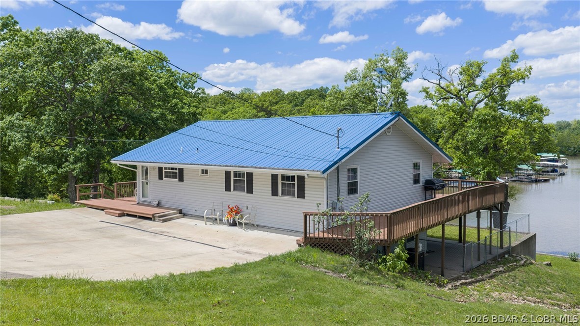 Enjoy lakefront living at its best in this beautifully remodeled 4-bedroom, 2-bath home tucked into a peaceful, quiet cove at the 93 mile marker. This property features a fully finished walk-out lower level, offering plenty of space for family and guests.
The updated kitchen boasts brand-new granite countertops and all new appliances, while the lower level has been refreshed with new carpet. The home also includes a metal roof and a water softener installed just one year ago. Outdoor enthusiasts will love the impressive dock setup with 3 wells and three 29x40 slips, plus a swim dock—perfect for enjoying the lake all season long. The property also includes a spacious 24x38 shop with electricity that can accommodate up to four vehicles, a carport, and an additional storage shed for all your extras. Surveyed and well-maintained, this property offers the ideal blend of comfort, functionality, and lakefront lifestyle. Whether you're looking for a full-time residence or a weekend retreat, this one checks all the boxes. Call for a private showing today!
