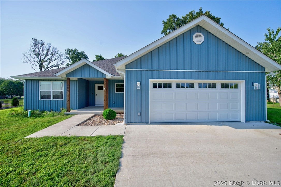 Built in 2023 and thoughtfully designed for easy, comfortable living, this 3BR, 2BA home offers 1,789sq feet of open-concept living space in a convenient location between Lebanon and Camdenton. The spacious kitchen features abundant cabinetry, granite countertops, a large island, and plenty of room to gather, opening directly to the main living area. The primary suite offers a private retreat with a walk-in closet, soaking tub, separate shower, and generous vanity space. Outside, enjoy a low-maintenance yard with an established garden area ready for flowers, vegetables, or whatever you choose to grow. The two-car garage provides additional storage and everyday convenience. Located close to the park and pickleball courts, you'll have recreational opportunities nearby while still being conveniently positioned for easy access to shopping, dining, and everyday amenities while still enjoying the feel of a quieter residential setting. With a recent price improvement and no HOA, this newer home is worth a closer look.