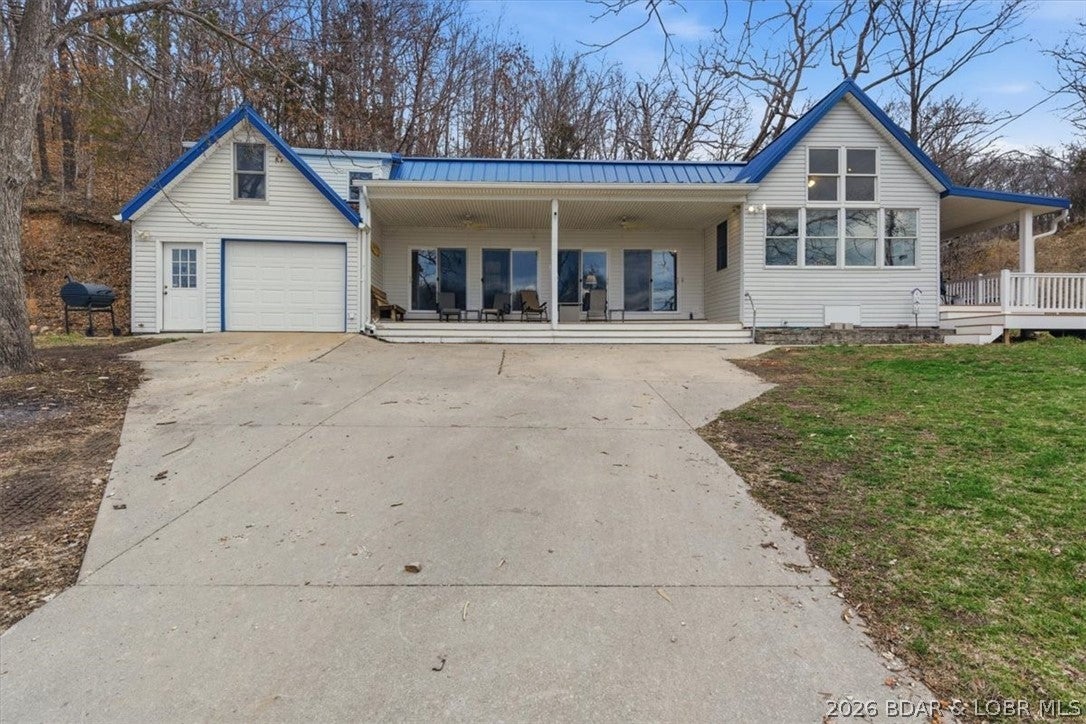 Looking for the lake house where the whole family fits? This 5-bedroom, 5-bath home in desirable Indian Creek Cove was made for gathering, relaxing and making memories. The main level offers an expansive family room with vaulted ceilings, floor-to-ceiling windows showcasing beautiful lake views and a cozy fireplace. The large kitchen is perfect for preparing meals for a crowd, with a generous dining area for everyone to gather. Also on the main level are the primary bedroom with private bath, two guest bedrooms, a full bath and laundry. Upstairs, two oversized bedrooms are designed for multiple beds or bunks—perfect for cousins, grandkids or entire family groups—and each has its own private bath, giving everyone room to spread out while staying close. Enjoy protected cove water away from rough main-channel traffic plus a private dock for easy lake access. Full-time, weekends or the family lake house everyone comes back to year after year—this one is ready for its next chapter. Schedule your showing today.