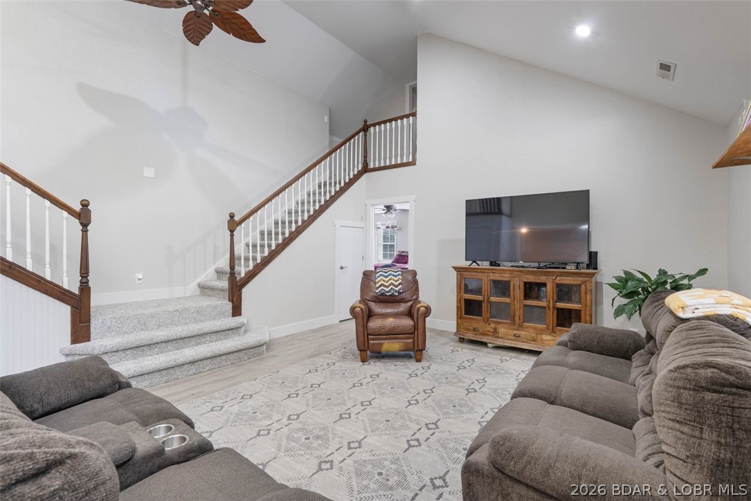 Don't miss this exceptional 4-bedroom, 3-bath home offering the perfect combination of space, comfort, and functionality. The heart of the home is a spacious open great room featuring stunning staircases leading to the upper level, creating an impressive gathering space. Enjoy the convenience of true main-level living in this thoughtfully designed home. Connected directly to the primary suite is a versatile bonus room that can easily adapt to your lifestyle. Use it as a home office, nursery, playroom, fitness space, reading retreat, or cozy sitting area—possibilities are endless. Recent updates include new flooring, fresh interior paint, and refrigerator, diswasher and stove, making this home move-in ready. Outside, you'll find a large attached 2-car garage along with an impressive 2,500-square-foot metal building—ideal for a workshop, storing equipment, hobbies, or additional vehicles. Situated on three lots, the property offers abundant outdoor space with endless possibilities for recreation, gardening, or future expansion.  This unique property delivers the space you need, the updates you'll appreciate, and the versatility you've been looking for. Schedule your private showing!